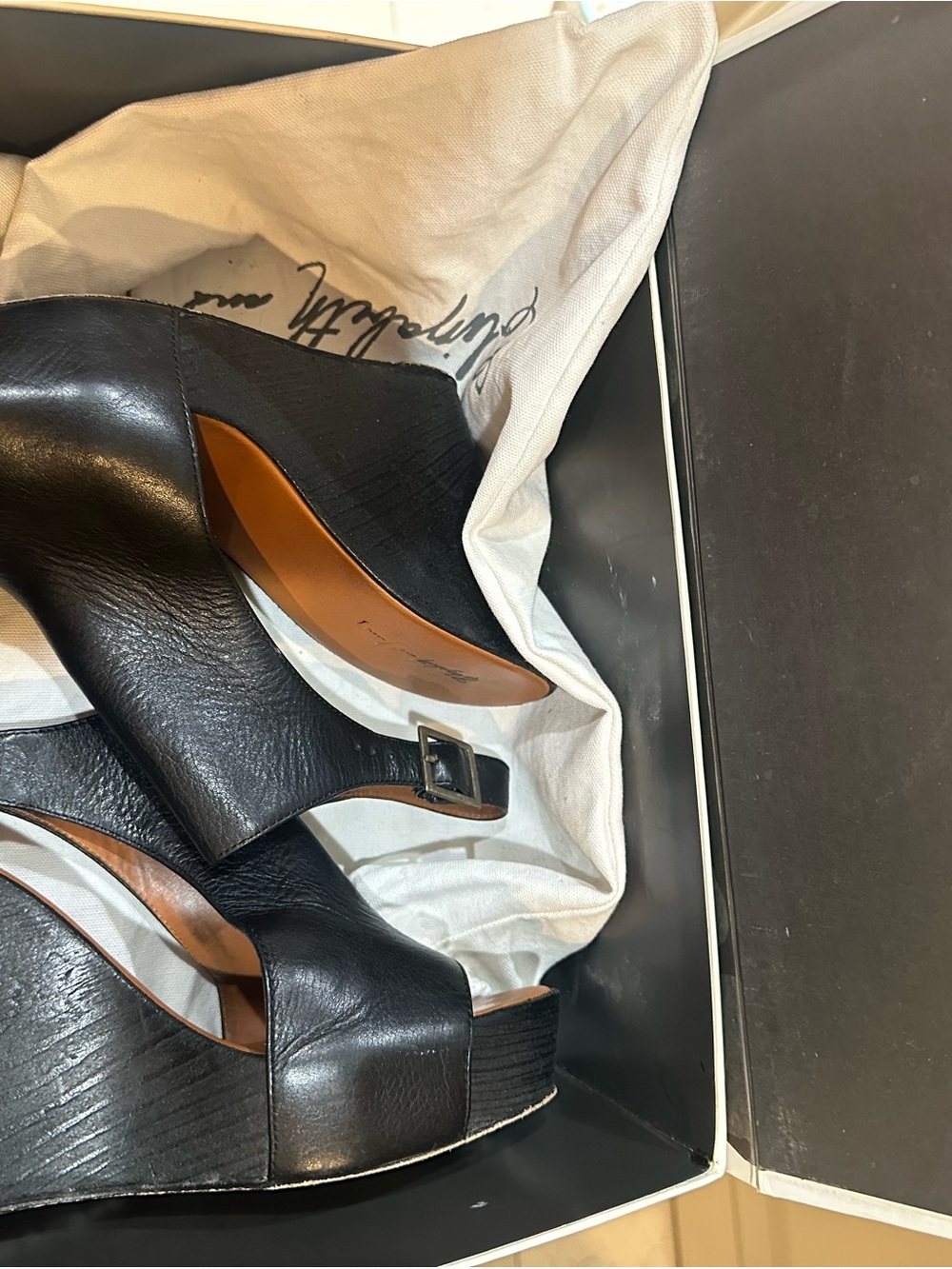 Elizabeth and James Black Leather Wedge Sandals with Buckle Detail